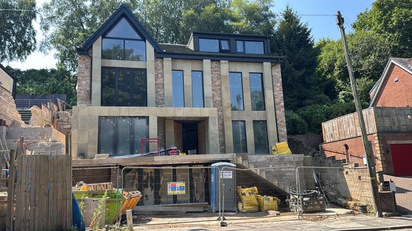 Completed stone clad new build home by Haizain Construction